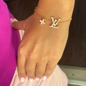 IV Iconic bracelet features a trio of Louis Vuitton emblems.